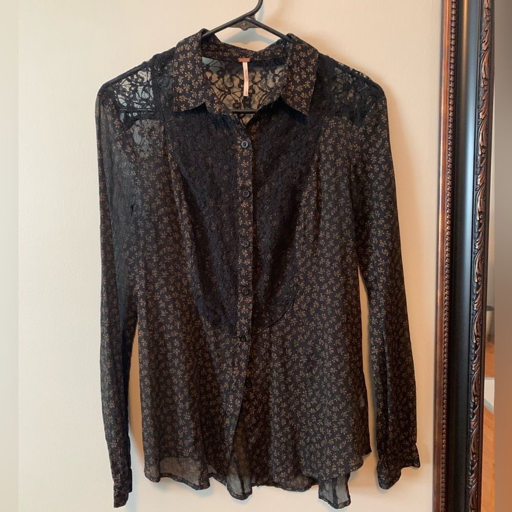 Free People sheer black floral blouse.